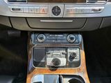 a picture of a car dashboard with a radio and a cup holder