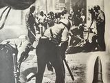 an old black and white photo of a man holding a gun