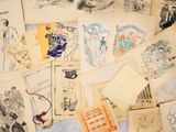 a lot of old postcards on the table