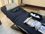 a massage table with a lot of items on it