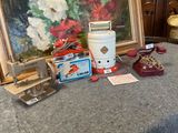 a picture of a painting, a sewing machine, and other items on a table