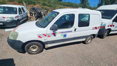 a white van that is parked in a parking lot