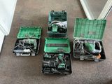 four different tools in a green case on the floor