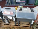 three plastic bins that are sitting on a pallet