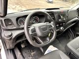 a dashboard and steering wheel of a vehicle with a view of a dirt field