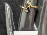 a ring on a hand with a price tag on it