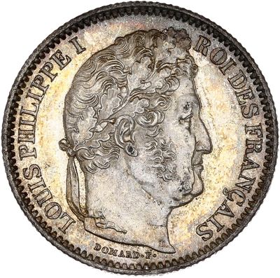 gros plan d'une pièce de monnaie sur laquelle figure une tête d'homme