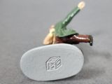 a small toy figurine of a man riding a skateboard