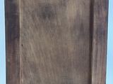 an old wooden easel with a wooden frame on top of it