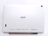 the back of a white laptop computer sitting on top of a white table