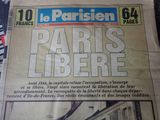 newspaper with a picture of a train on the front of it