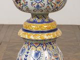 a vase that is sitting on top of a wooden table