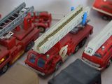 a lot of toy firetrucks on a table