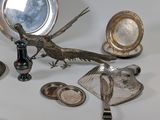 a table with a lot of silver objects on it