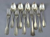 eight silverplated spoons and six forks are arranged in a row