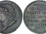 a close up of a silver coin with a woman ' s face on it