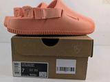 a close up of a pair of pink shoes on top of a box