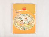 a yellow book with a picture of a woman on it