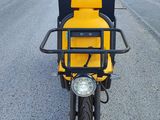 a yellow motorcycle parked on the side of the road