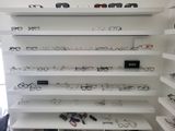many glasses on the shelves in the room