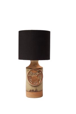 the table lamp has a black shade on top of it