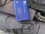 a blue battery in the back seat of a car