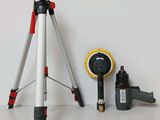 a tripod and a camera on a white table