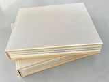 a stack of white sheets of paper sitting on top of a table