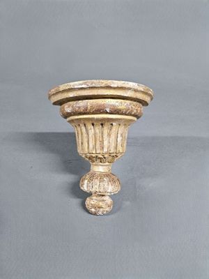 a white vase with a brown stripe on it