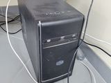 a computer that is sitting on the floor next to the wall