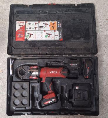 an image of a tool kit in a black case on the floor