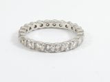 a close up of a diamond ring on a white surface