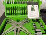 a green case with tools in it on a table