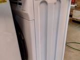an image of a washing machine and a dryer in a warehouse