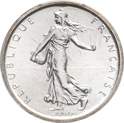 an image of a silver coin with a lady holding a tennis racquet