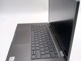 a black laptop with a black keyboard on a white surface