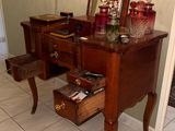 a dresser with a mirror and a drawer on it