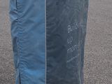 a large blue bag sitting in the middle of a parking lot