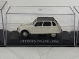 a small white car in a clear display case