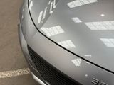 a close up of a car parked in a parking lot