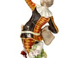 a figurine of a man on top of a cake