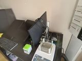 a desk with a laptop and a computer monitor on it