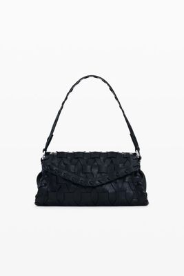 a black handbag with a handle and a strap