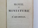 an open book on a white surface with a black and white title