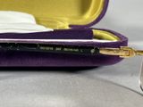 a purple case with a pair of glasses in it
