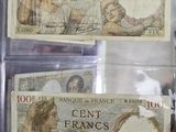 two bank notes in a clear case on display