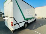 an image of a white trailer parked in a parking lot