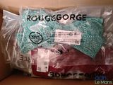 a package of clothing in a box with a bow tie