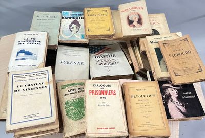 a lot of books that are sitting on a table