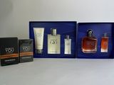 a couple of bottles of perfume sitting on top of a table